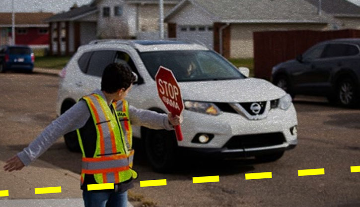 young school patroller stopping car