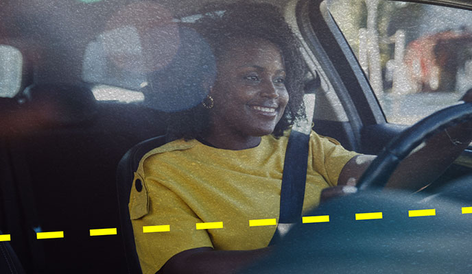 woman driving with smile